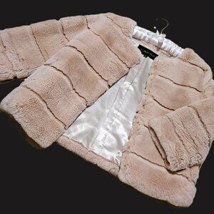 SUMPTUOUS GENUINE FUR JACKET FEATURING 3/4 SLEEVE W/ HIDDEN HOOK & EYE CLOSURES